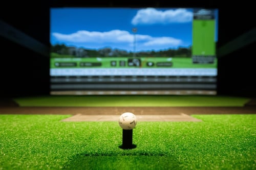 Golf ball on tee at simulator