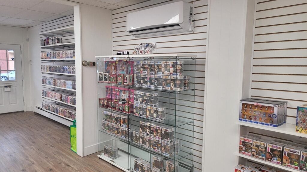 Interior of D&H Toys showcasing wall shelving