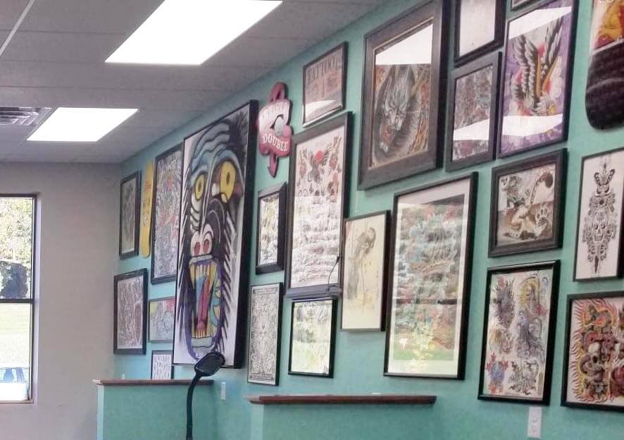 Burnsville MN Aloha Monkey commercial renovation results in creative wall of tattoo art 