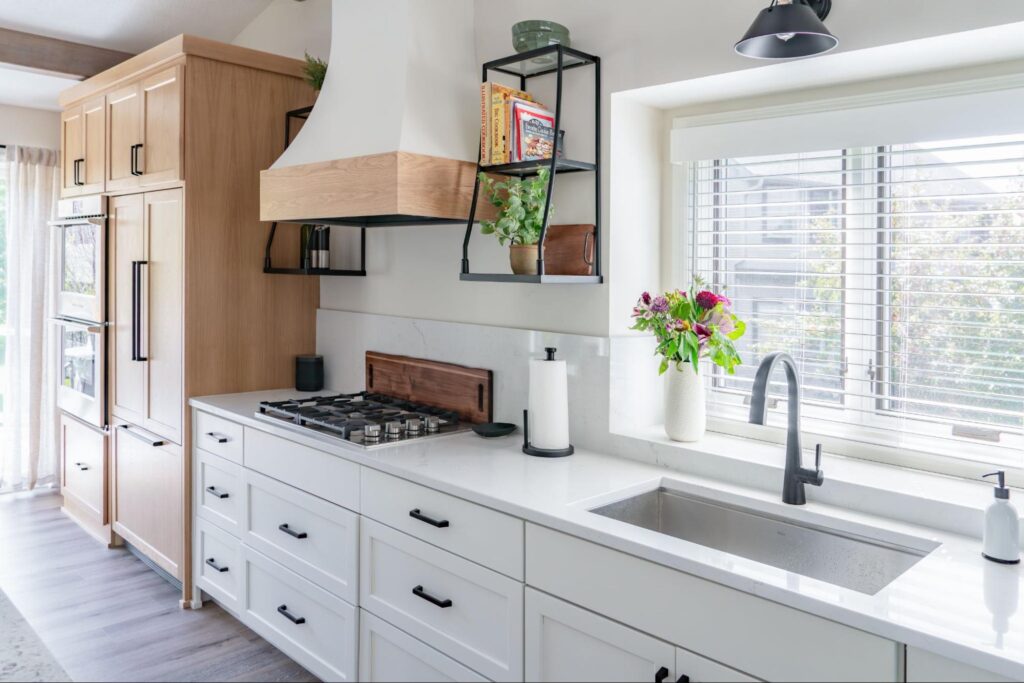 a kitchen with a workstation sink 