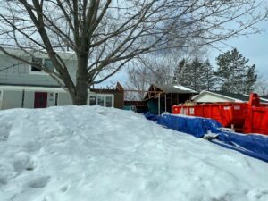 exterior of a home being remodeled in winter
