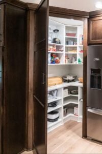 kitchen with a view into a pantry