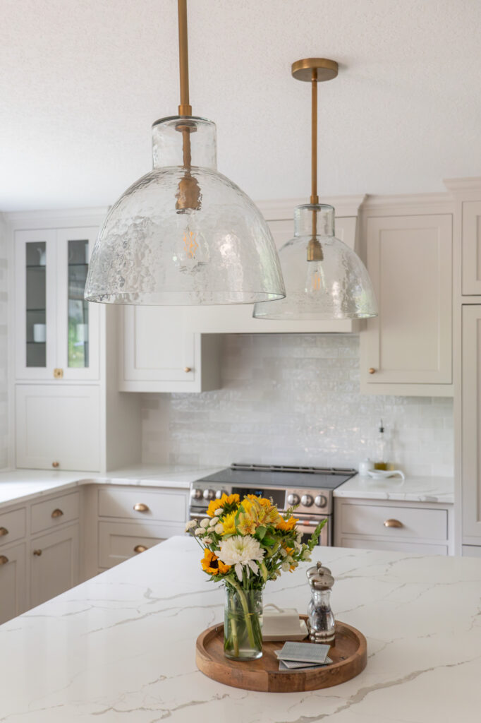 a close up of light fixtures with golden accents