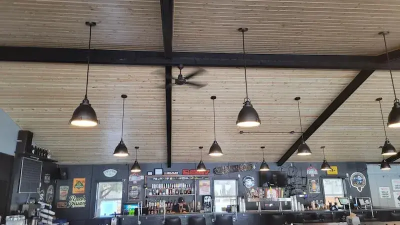 industrial lighting and wood ceiling update in commercial restaurant/bar