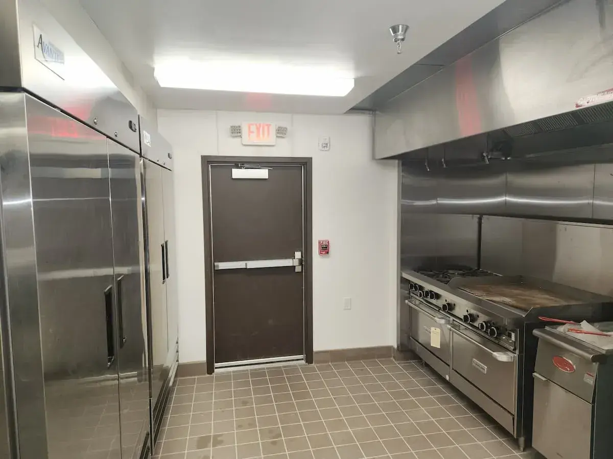 flat top grill and cold storage in commercial kitchen
