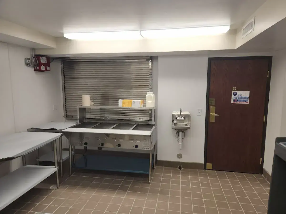 quadruple sink and prep area in commercial kitchen