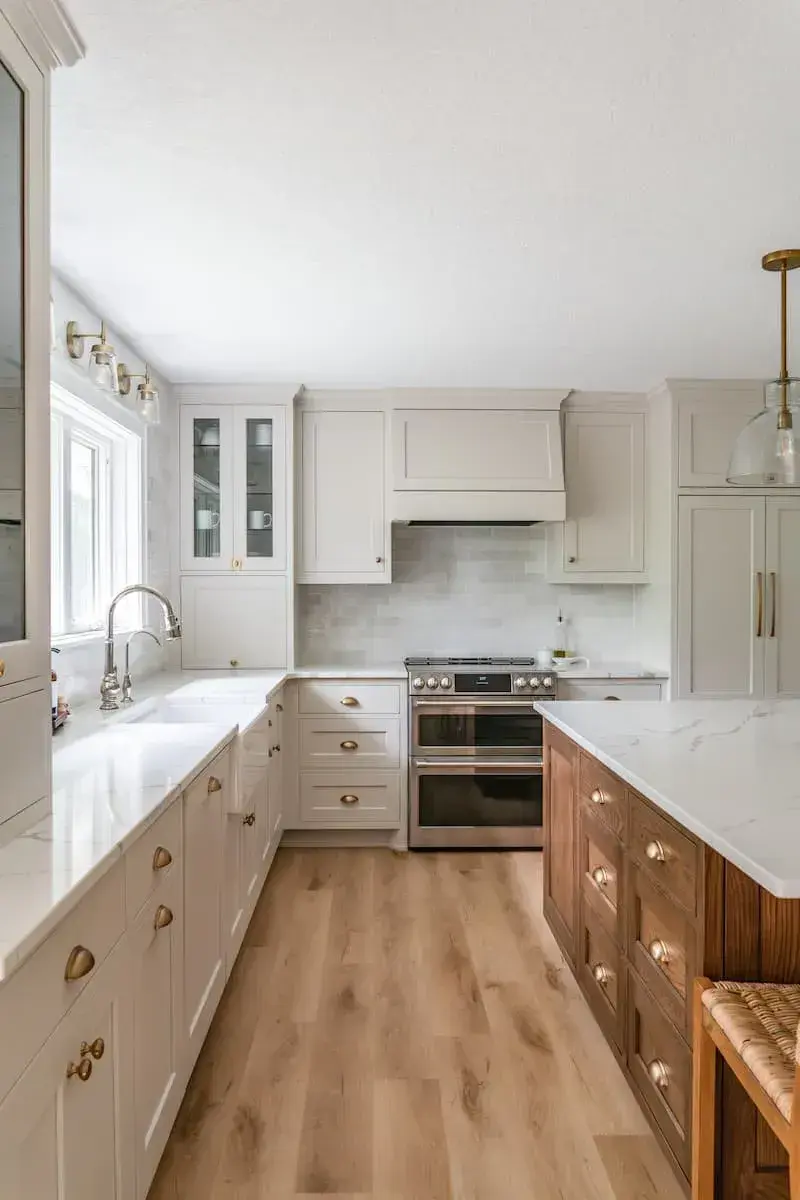 contrasting wood island against white cabinet and countertops