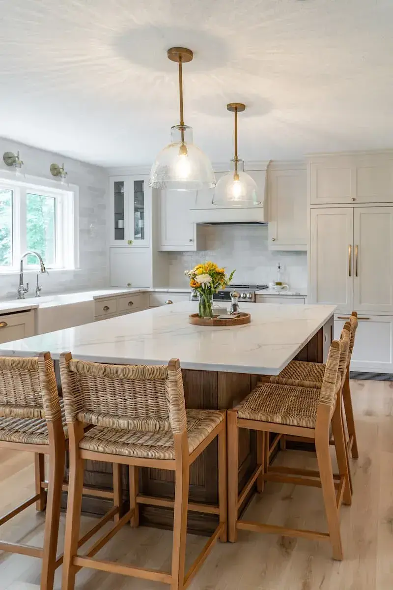 oversize island with glass pendants and antique gold hardware
