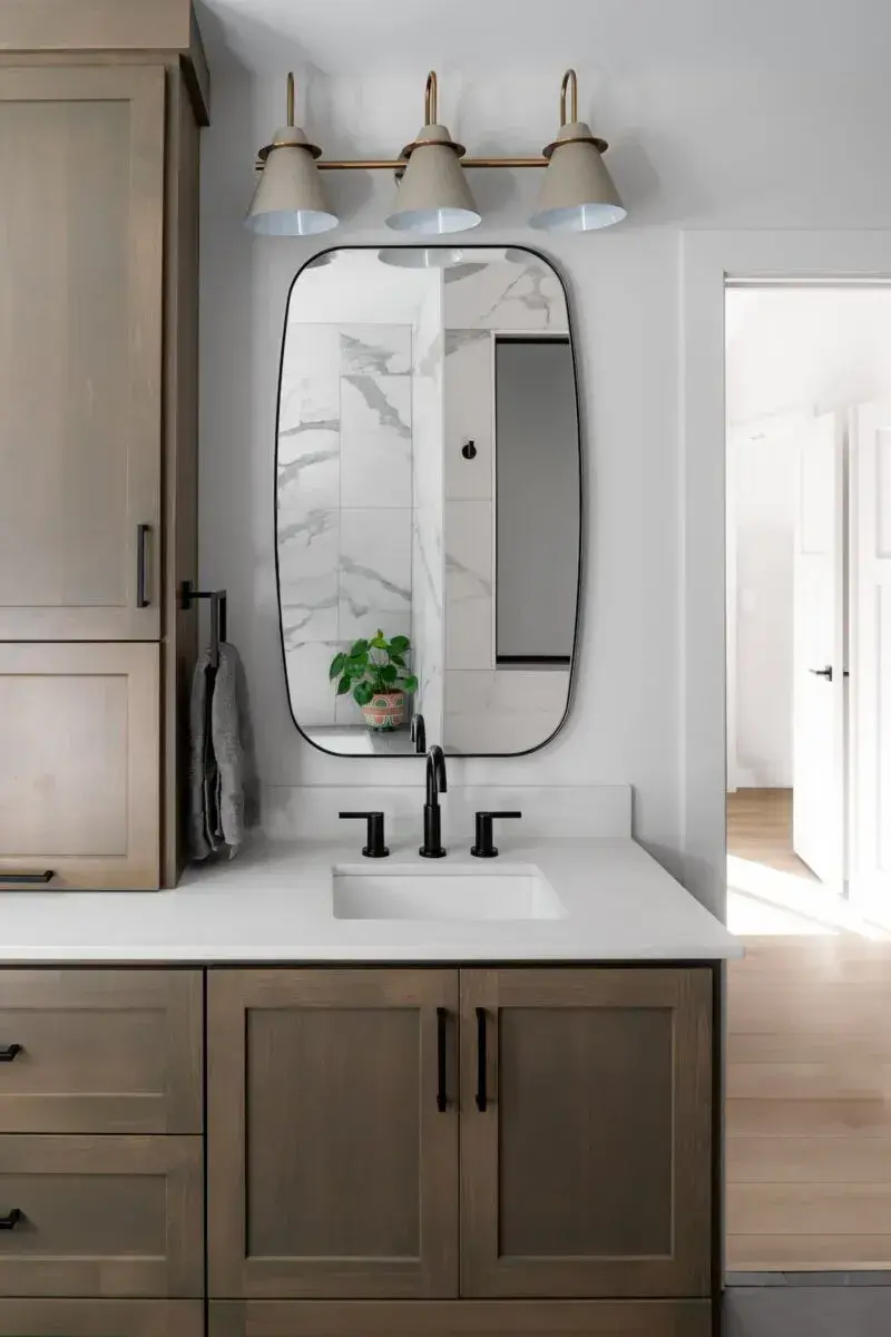wood vanity with double sinks and middle cabinet