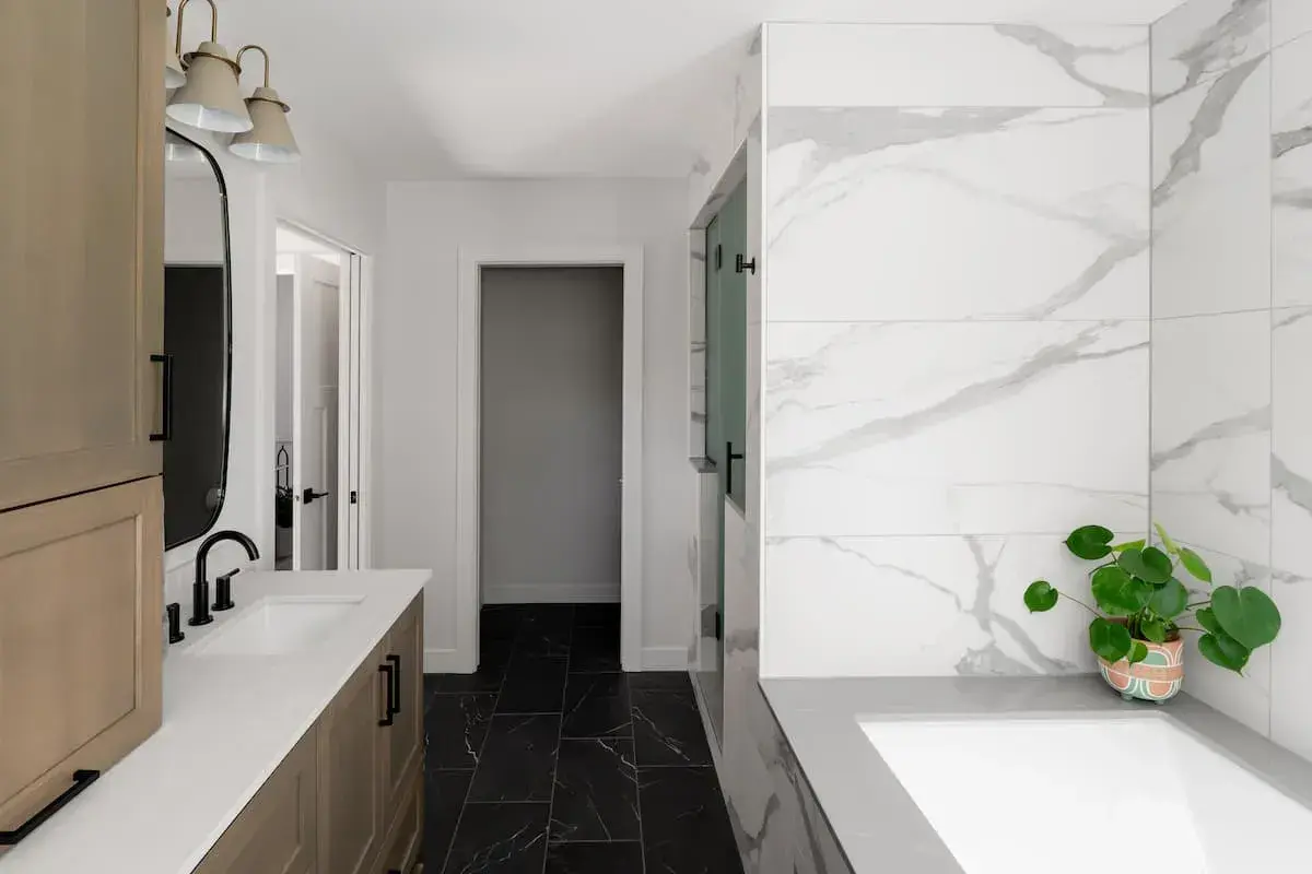 marble bathroom view of tub and vanity in room layout