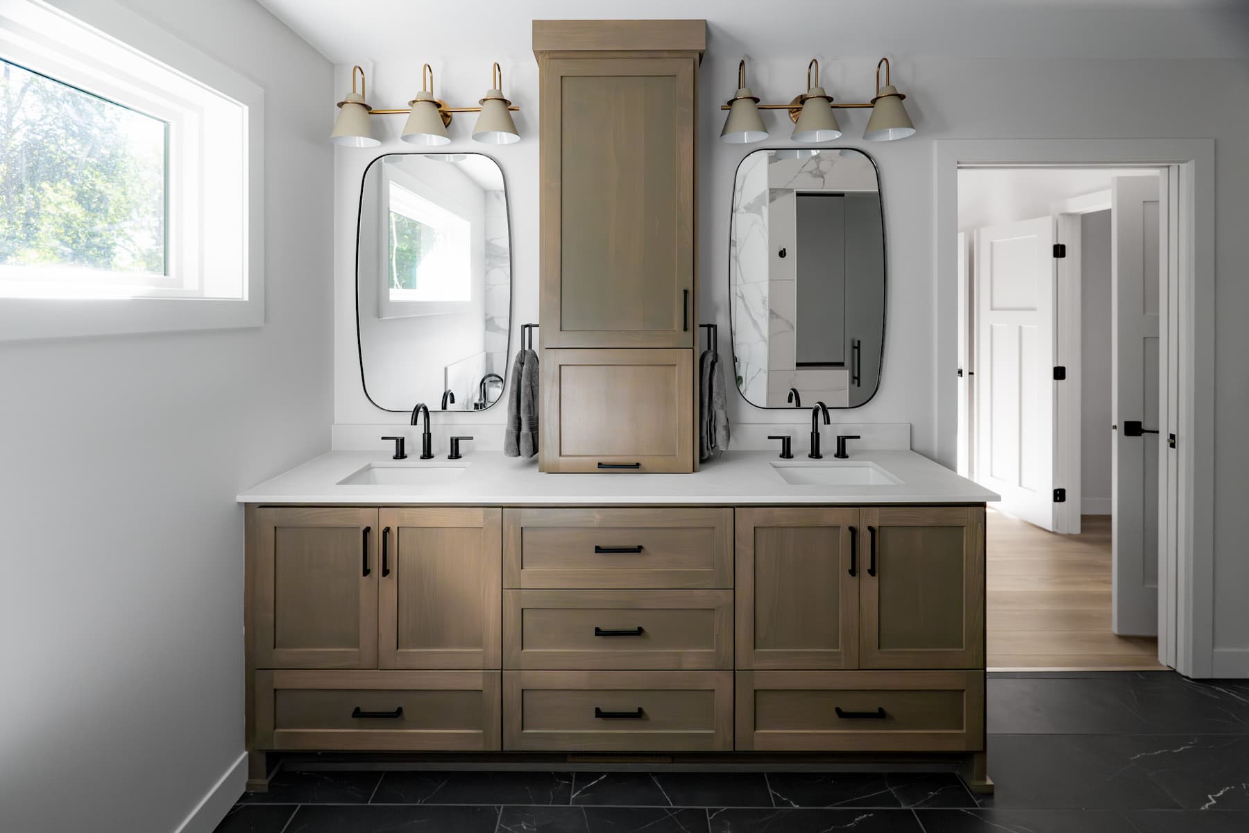 bathroom with large dual vanity, featuring ample built-in storage