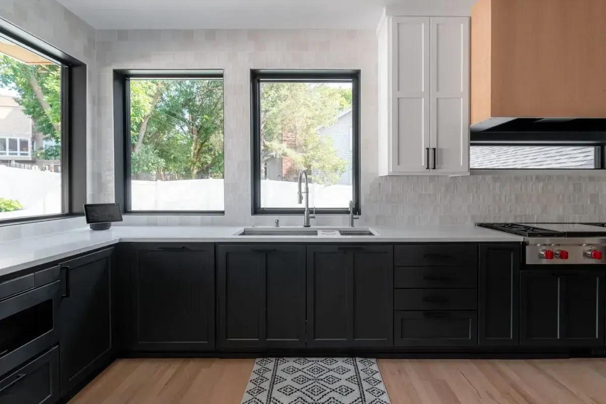 Black lower cabinets with white uppers. Zellige tile backsplash