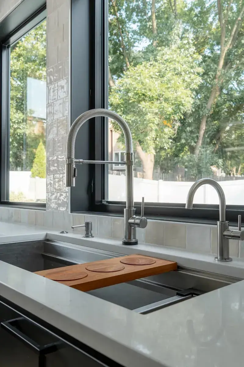 large kitchen sink with delta extendable faucet and water dispenser