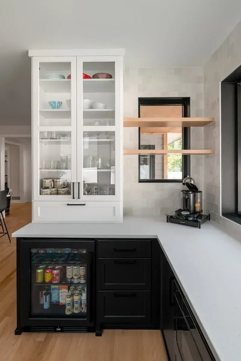 glass front cabinets with built in beverage fridge and coffee station