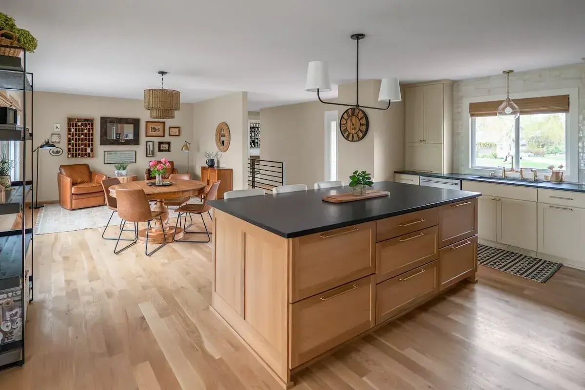 modern open concept kitchen and dining design with adjacent sun room