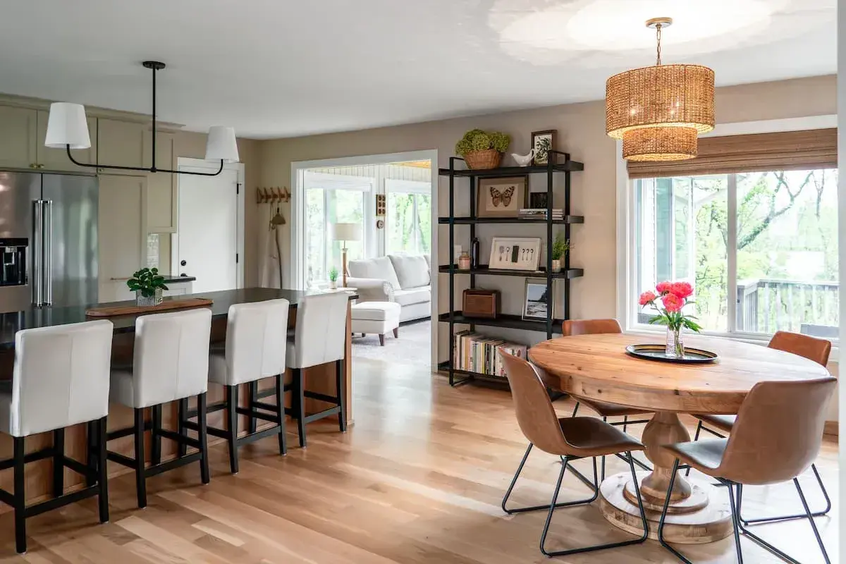 modern open concept kitchen and dining design with adjacent sun room