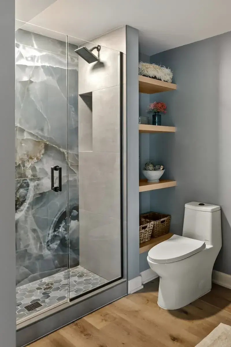 bathroom shower with large format tile, built in open shelving