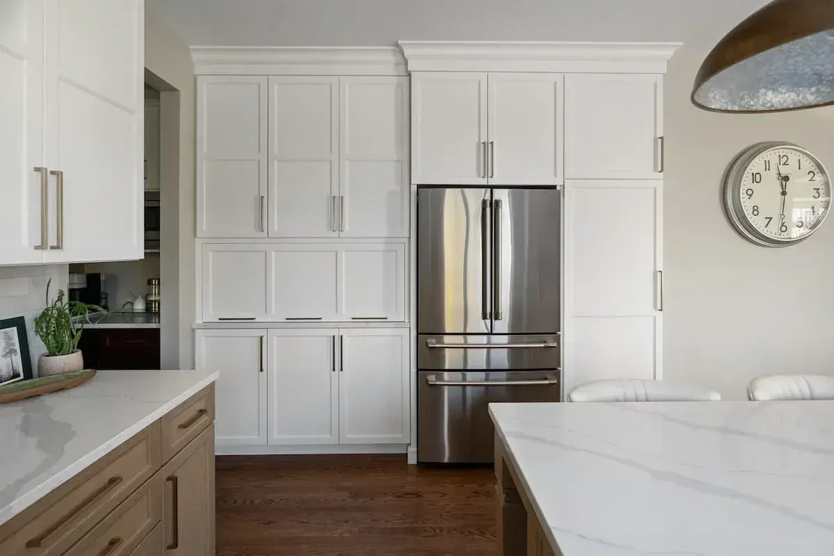 built in kitchen storage around the refrigerator