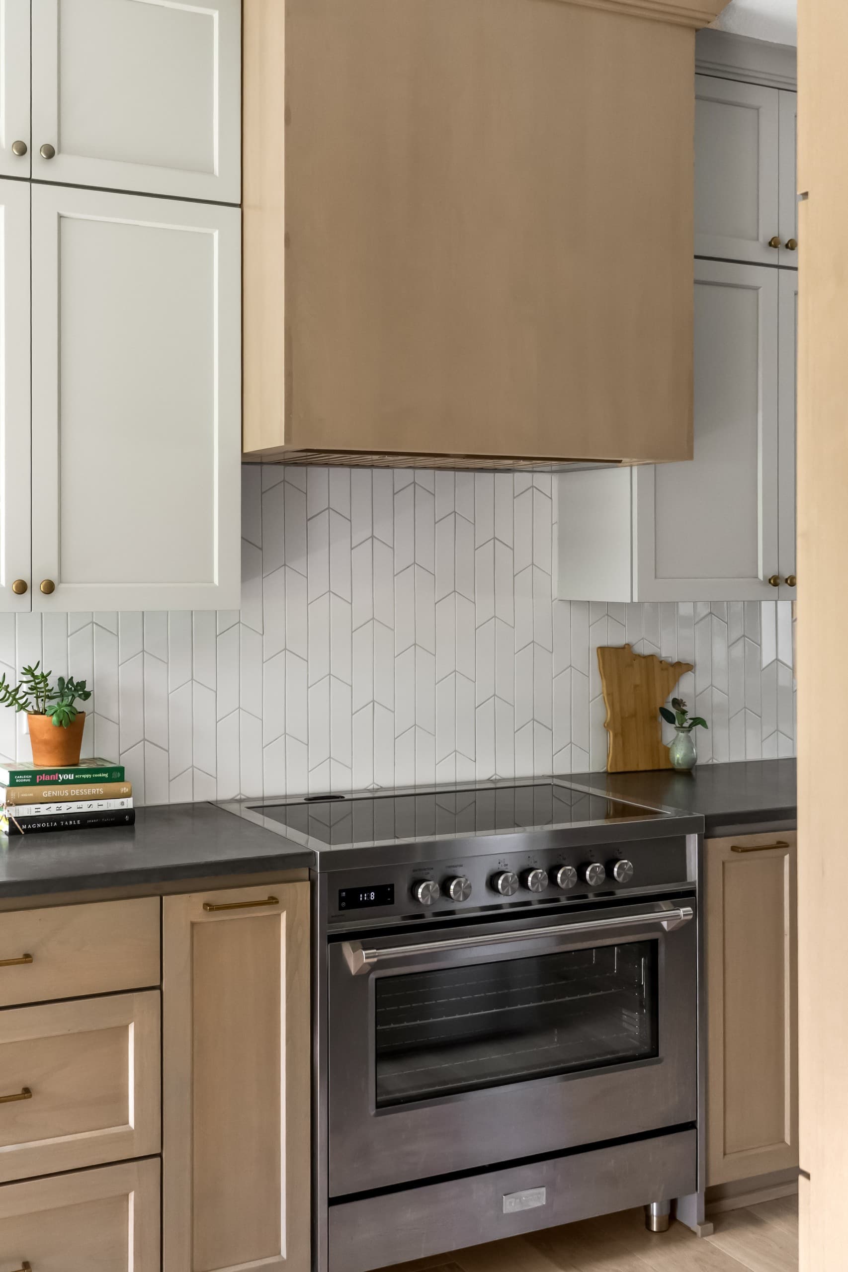 a chic boho kitchen with taupe cabinets and warm gray countertops