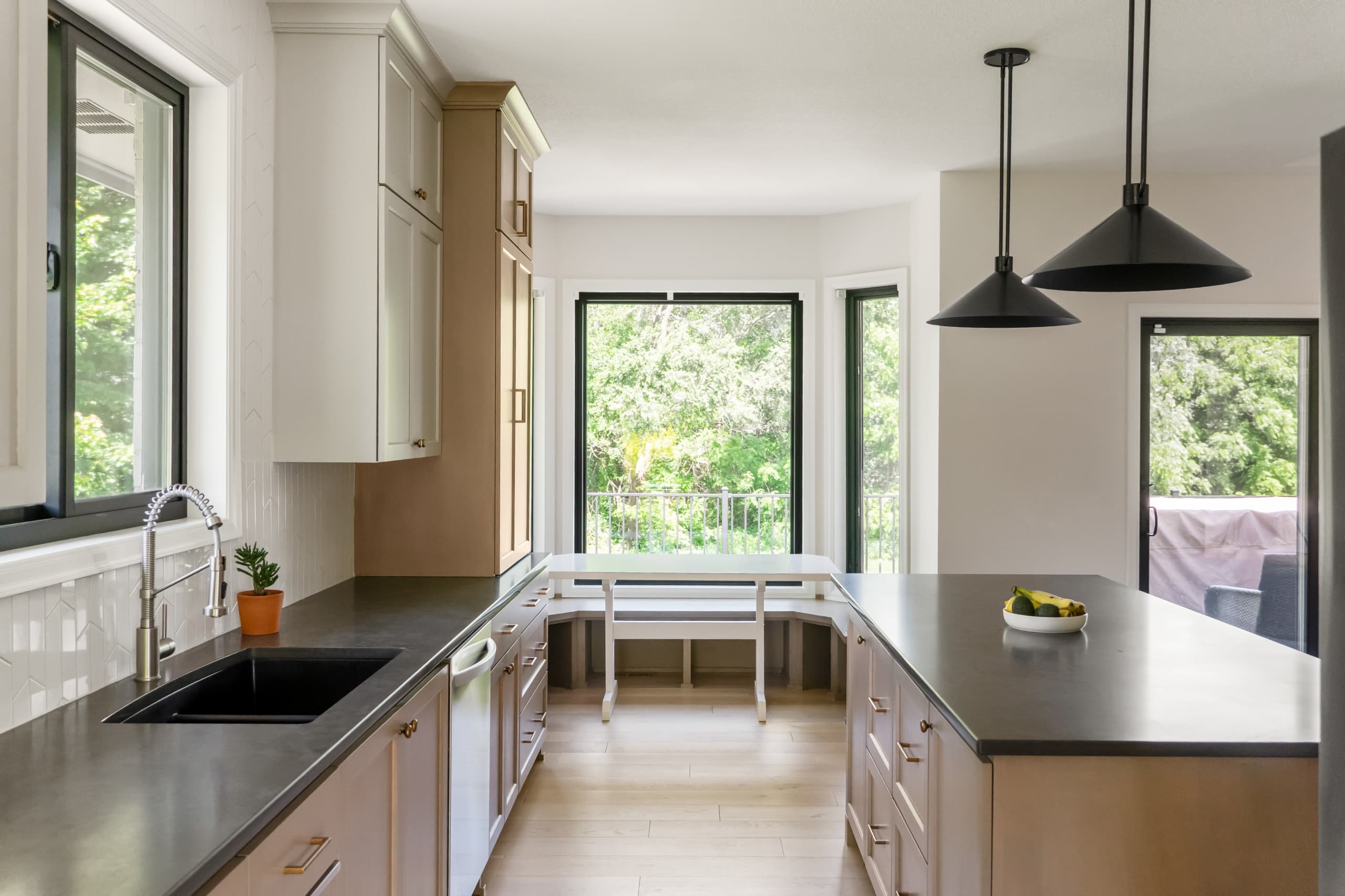 a chic boho kitchen with taupe cabinets and warm gray countertops