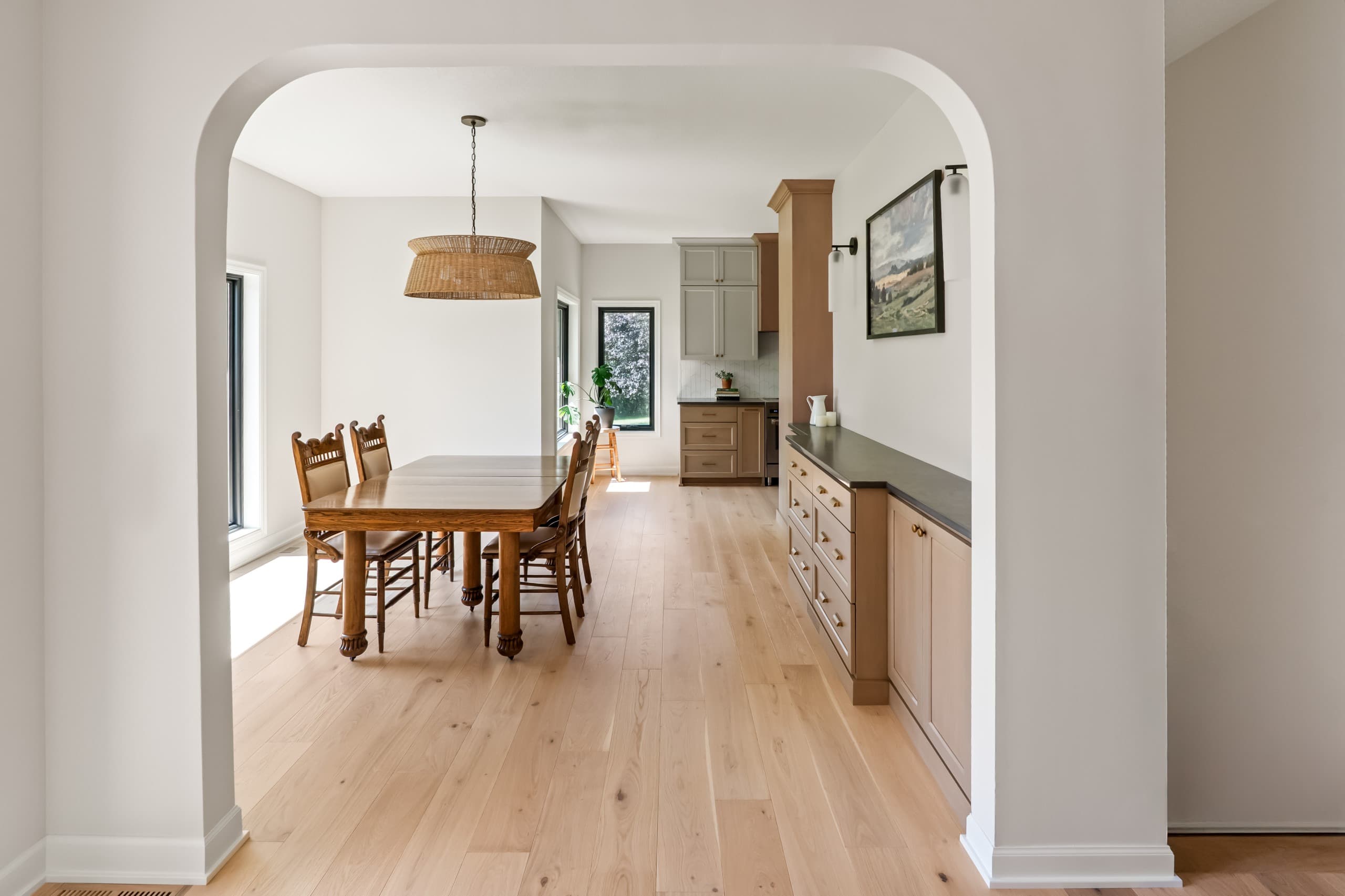 a chic boho kitchen with taupe cabinets and warm gray countertops