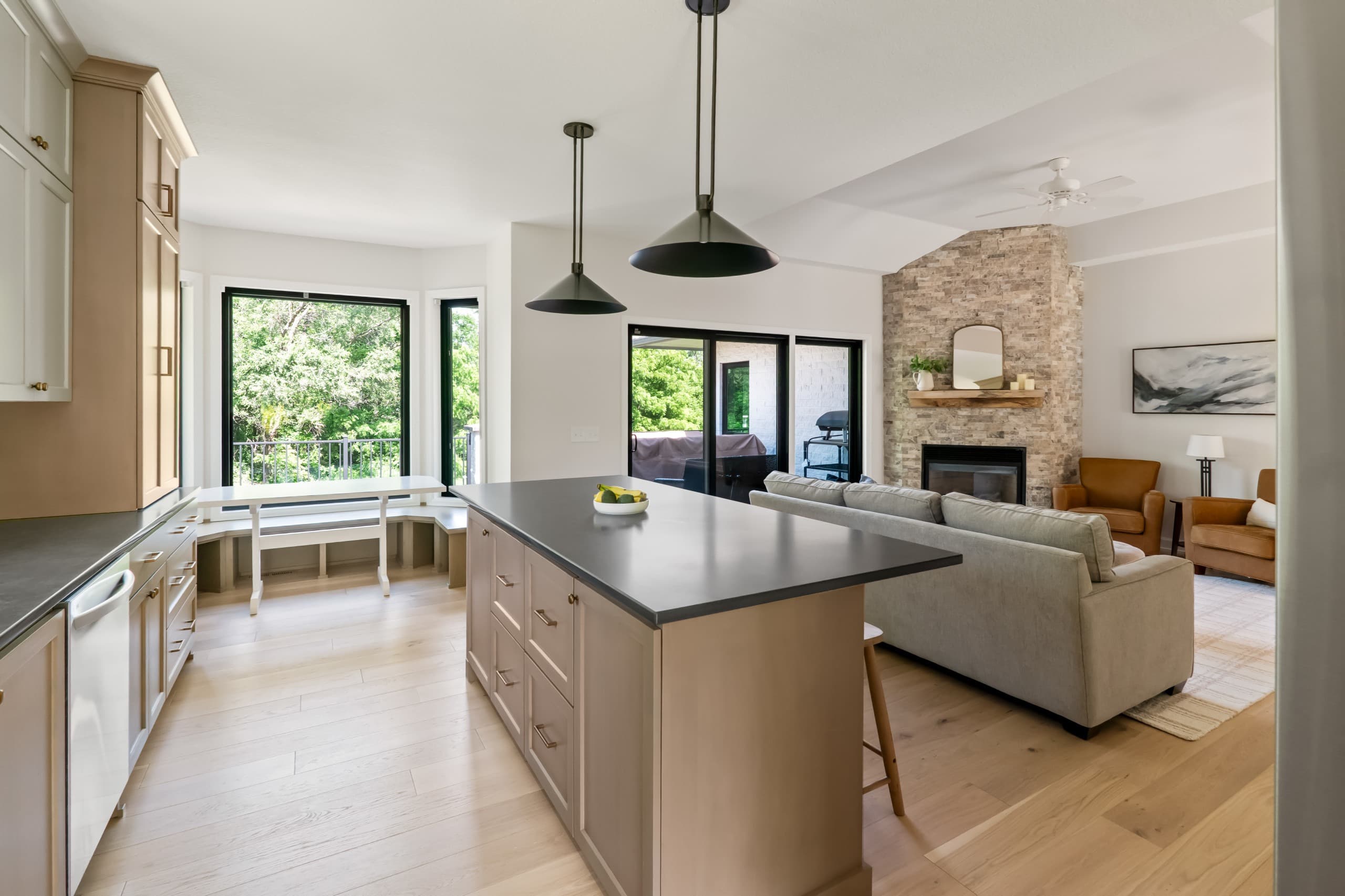 a chic boho kitchen with taupe cabinets and warm gray countertops